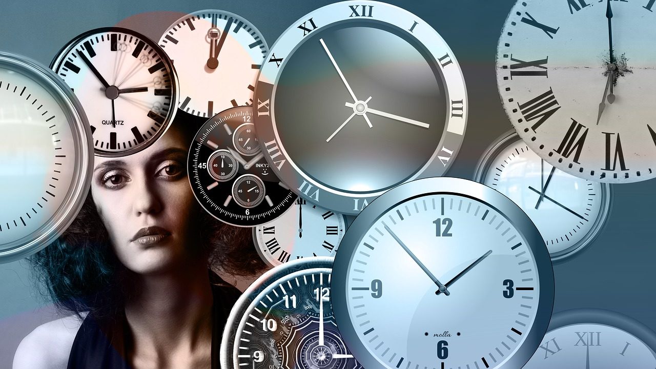photo of a woman with clocks